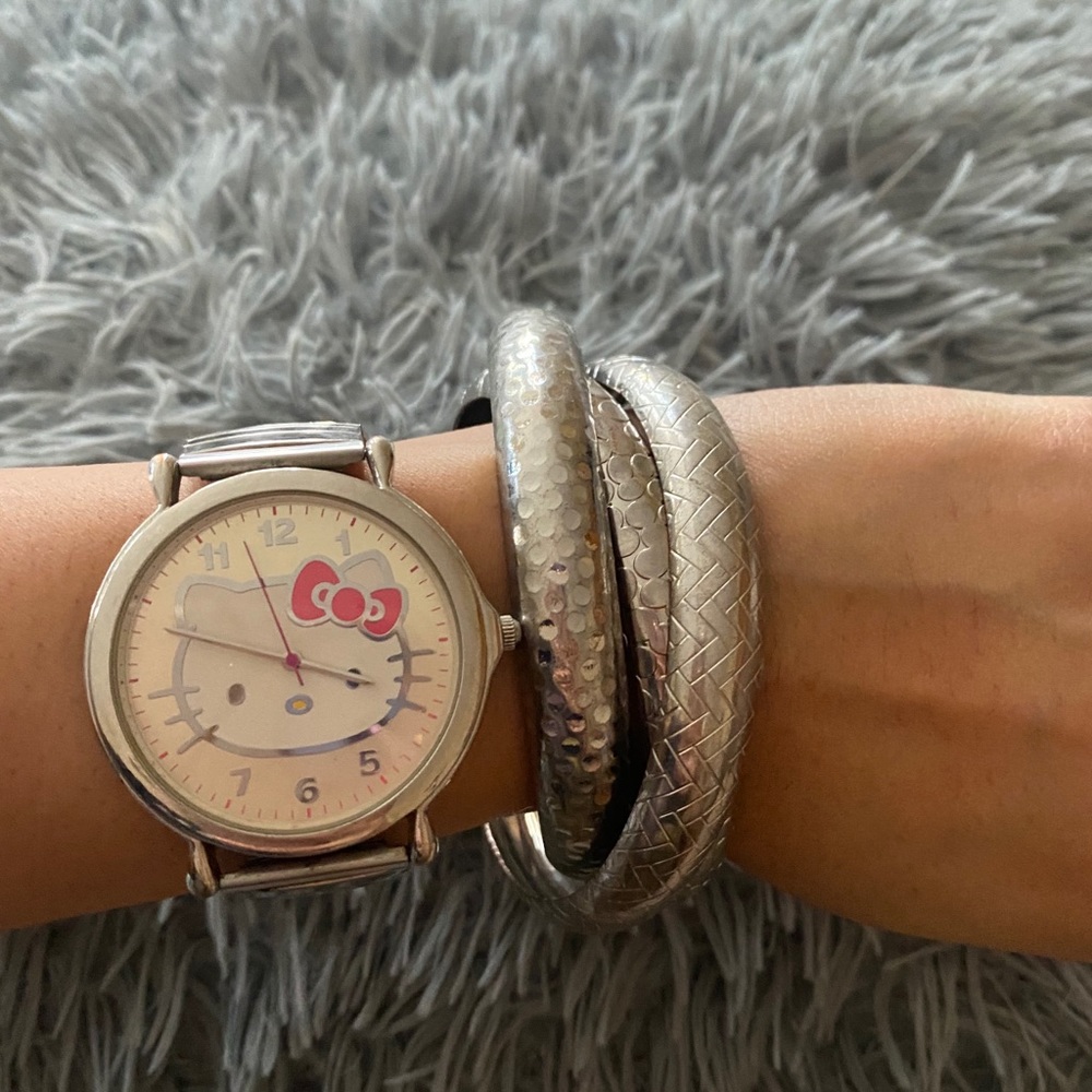 Hello kitty watch with set of silver bracelets